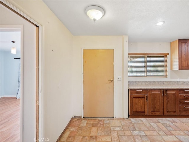 14435 Hopi Rd, Apple Valley, CA 92307 - kitchen with light countertops and stone finish flooring