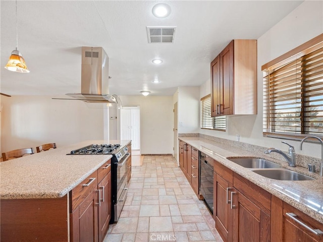 14435 Hopi Rd, Apple Valley, CA 92307 - kitchen featuring island exhaust hood, a sink, stone tile flooring, visible vents, and gas stove