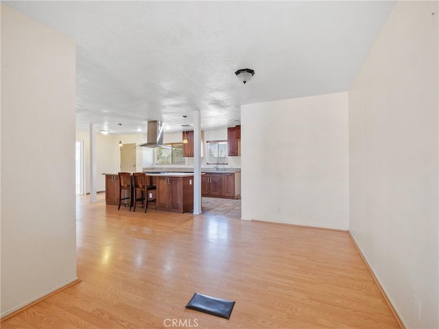 14435 Hopi Rd, Apple Valley, CA 92307 - living room with light wood-style flooring and baseboards