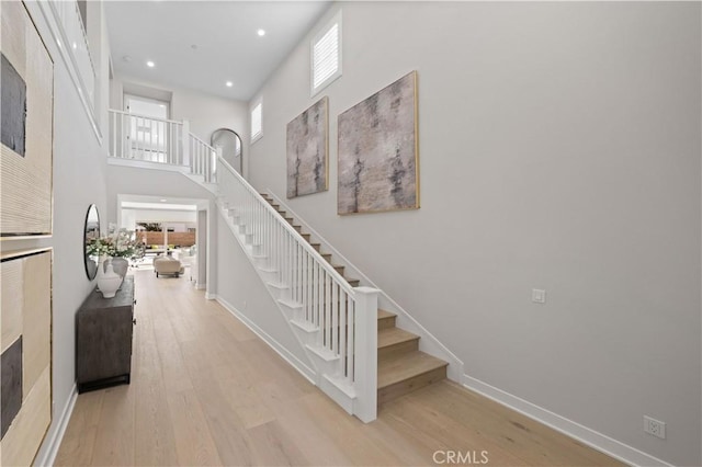 108 Hyperion, Irvine, CA 92618 - stairs with recessed lighting, wood finished floors, and baseboards