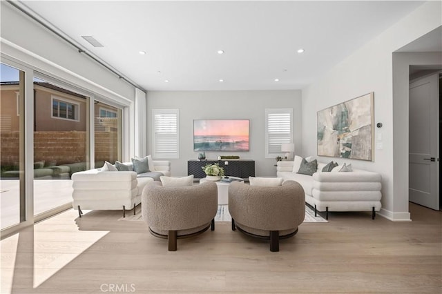 108 Hyperion, Irvine, CA 92618 - living room featuring plenty of natural light, light wood-style flooring, and recessed lighting
