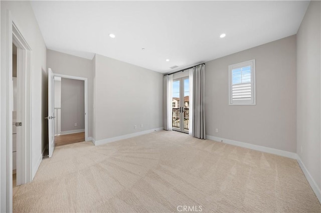 108 Hyperion, Irvine, CA 92618 - unfurnished bedroom featuring light carpet, baseboards, access to outside, and recessed lighting