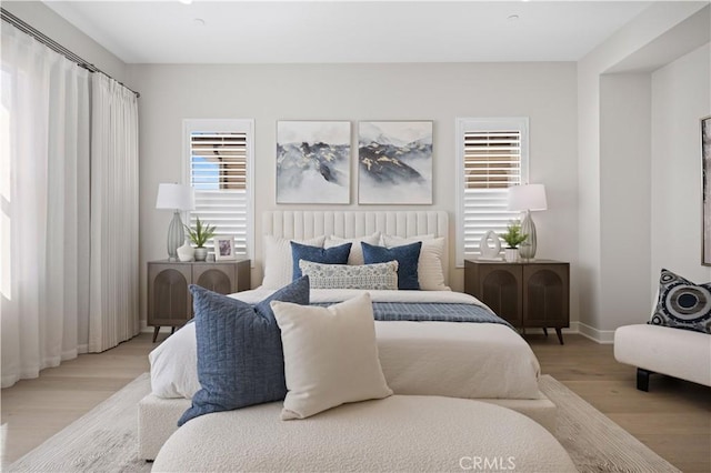 108 Hyperion, Irvine, CA 92618 - bedroom featuring baseboards and wood finished floors