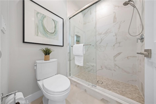 108 Hyperion, Irvine, CA 92618 - bathroom with baseboards, toilet, and a stall shower