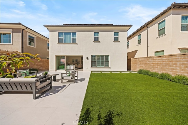 108 Hyperion, Irvine, CA 92618 - back of property featuring stucco siding, a lawn, fence, and an outdoor living space
