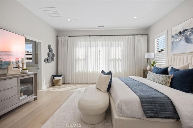 108 Hyperion, Irvine, CA 92618 - bedroom with recessed lighting, visible vents, light wood finished floors, and baseboards