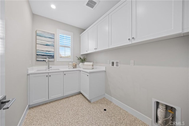 108 Hyperion, Irvine, CA 92618 - laundry area with cabinet space, visible vents, baseboards, and a sink
