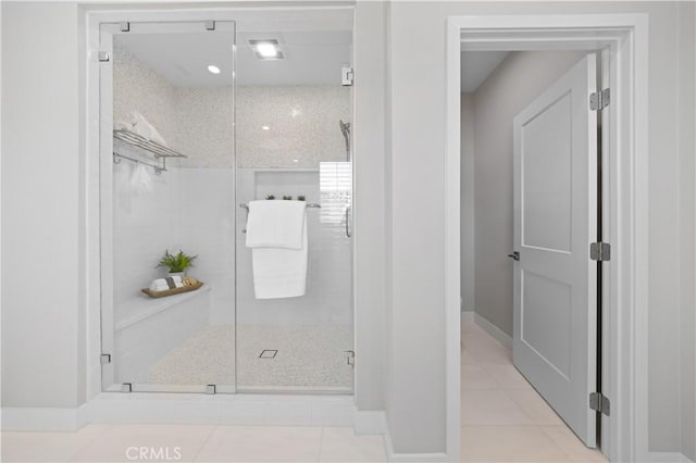 108 Hyperion, Irvine, CA 92618 - bathroom with baseboards, tile patterned floors, and a stall shower
