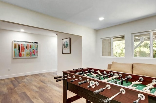 game room with recessed lighting, baseboards, and wood finished floors