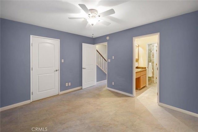 2235 W 25th St Unit 123, San Pedro, CA 90732 - unfurnished bedroom with baseboards, ceiling fan, and connected bathroom