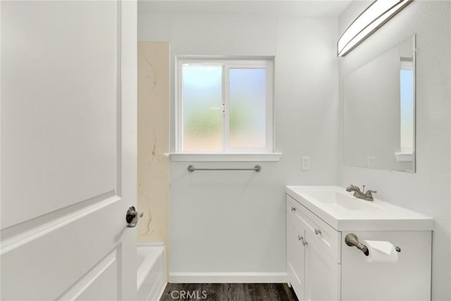 217 N Sacramento, Willows, CA 95988 - full bath with vanity, baseboards, wood finished floors, and shower / washtub combination