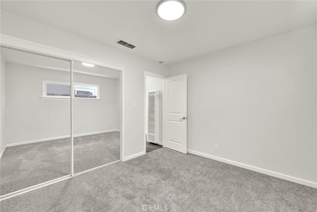 217 N Sacramento, Willows, CA 95988 - unfurnished bedroom featuring carpet floors, baseboards, a closet, and a heating unit
