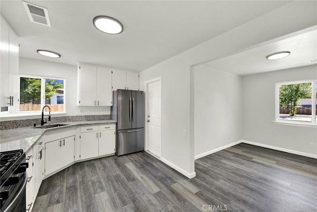217 N Sacramento, Willows, CA 95988 - kitchen featuring freestanding refrigerator, black range with gas stovetop, a sink, and plenty of natural light