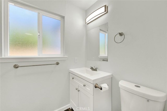 217 N Sacramento, Willows, CA 95988 - half bath featuring healthy amount of natural light, vanity, toilet, and baseboards