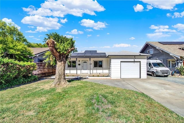 217 N Sacramento, Willows, CA 95988 - view of front of home with driveway, a garage, roof mounted solar panels, and a front yard
