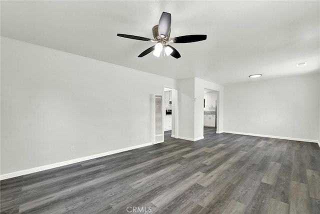 217 N Sacramento, Willows, CA 95988 - unfurnished living room with ceiling fan, dark wood-style floors, and baseboards