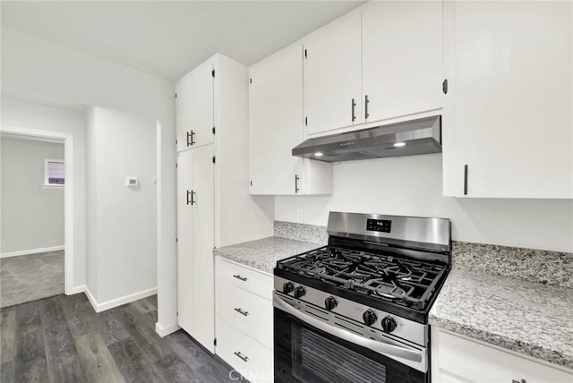 217 N Sacramento, Willows, CA 95988 - kitchen featuring under cabinet range hood, stainless steel gas range, dark wood-style flooring, white cabinetry, and baseboards