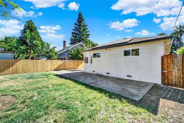 217 N Sacramento, Willows, CA 95988 - rear view of house with crawl space, roof mounted solar panels, a patio, and stucco siding