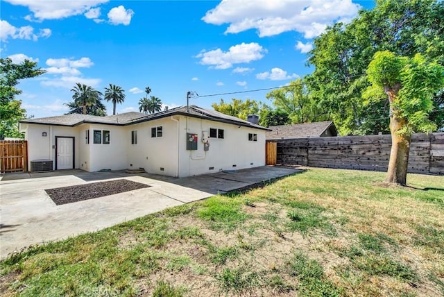 217 N Sacramento, Willows, CA 95988 - back of house with stucco siding, a patio area, and roof mounted solar panels