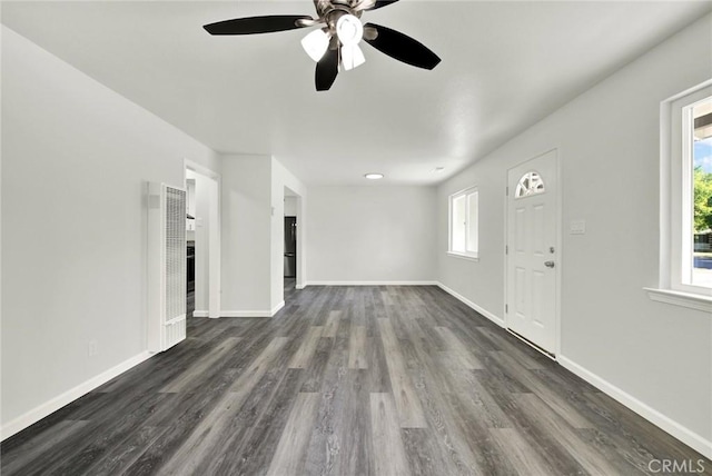 217 N Sacramento, Willows, CA 95988 - unfurnished living room with a heating unit, ceiling fan, dark wood-type flooring, and baseboards