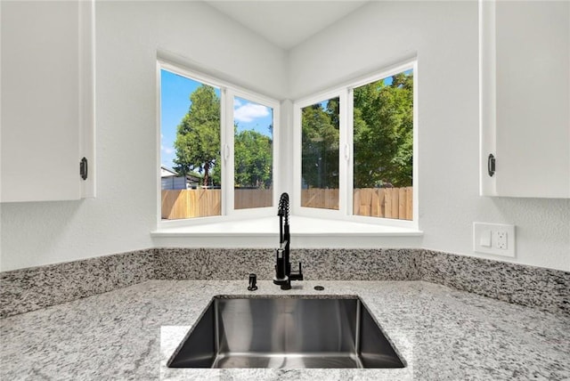 217 N Sacramento, Willows, CA 95988 - kitchen with a sink, light stone counters, white cabinets, and healthy amount of natural light