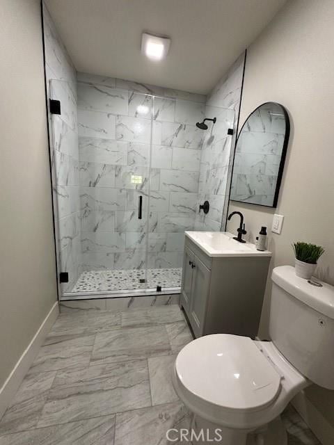 full bathroom featuring a stall shower, toilet, baseboards, marble finish floor, and vanity