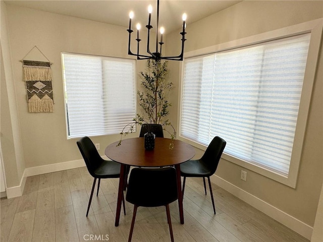 2209 W Glendon Way, Alhambra, CA 91803 - dining room featuring a chandelier, light wood finished floors, and baseboards