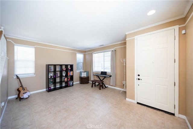entrance foyer featuring light tile patterned floors, baseboards, and ornamental molding