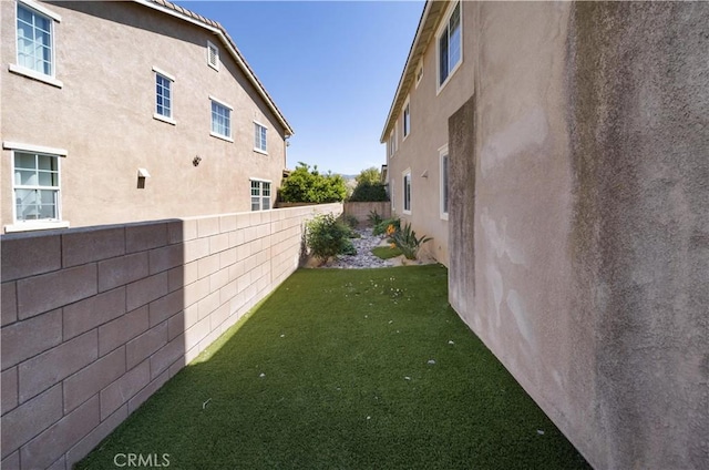 view of yard with a fenced backyard