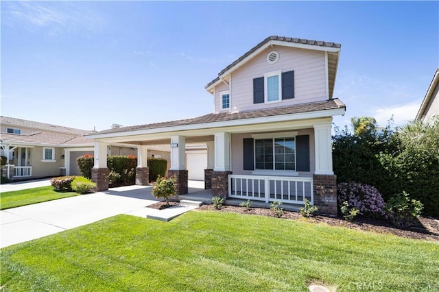 view of front of home with a front yard, covered porch, and concrete driveway
