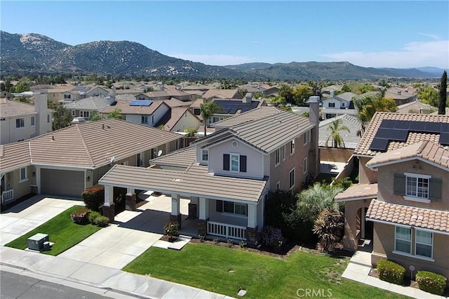 birds eye view of property featuring a mountain view and a residential view