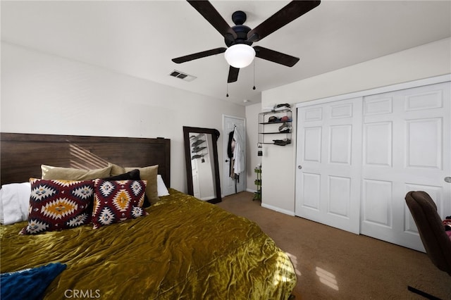 carpeted bedroom featuring visible vents, a ceiling fan, and a closet