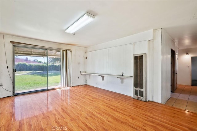 spare room with light wood-type flooring