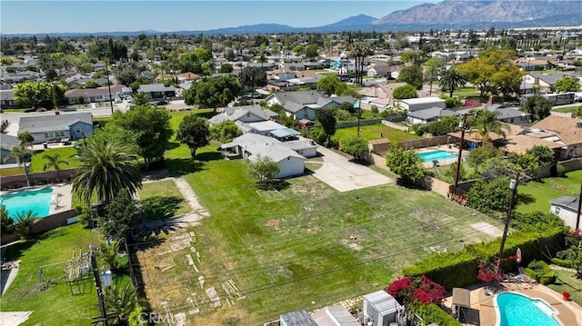 drone / aerial view featuring a mountain view and a residential view