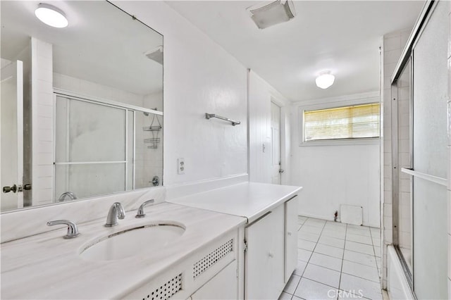full bathroom with shower / bath combination with glass door, tile patterned flooring, vanity, and visible vents