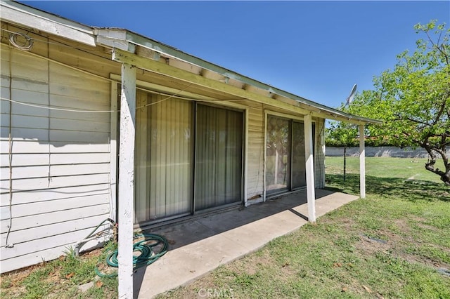 property entrance with a yard