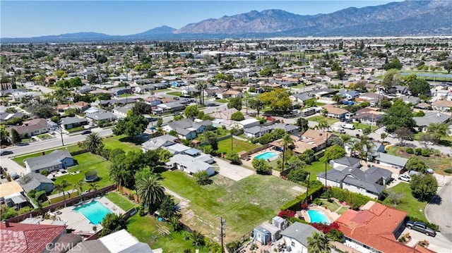 drone / aerial view featuring a mountain view and a residential view