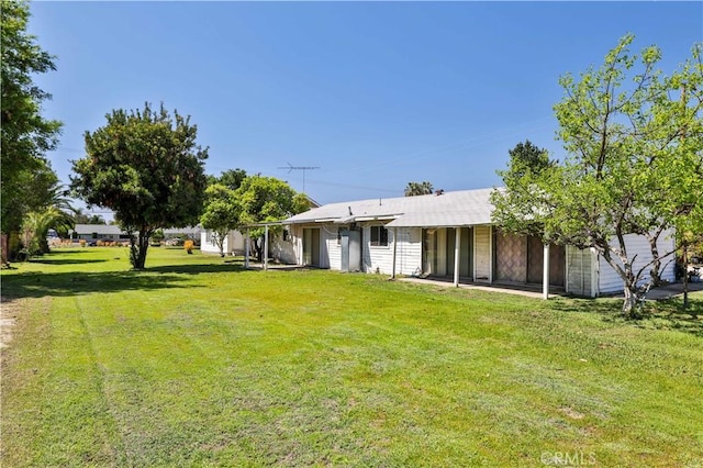 back of property with a yard