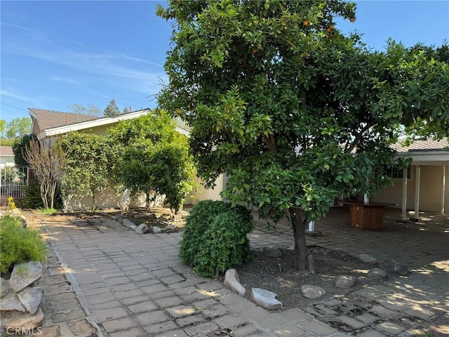 view of patio / terrace featuring fence