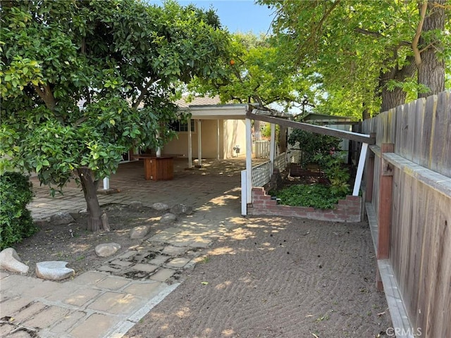 view of yard with a patio and a fenced backyard