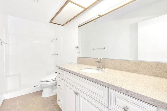 full bathroom with a shower, tile patterned floors, vanity, and toilet