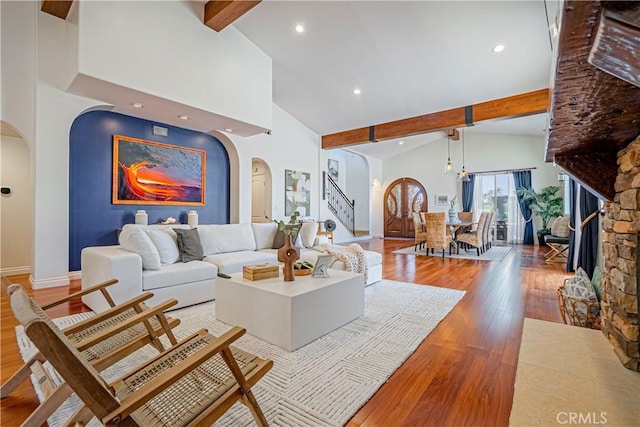 424 Camino De Encanto, Redondo Beach, CA 90277 - living room featuring beamed ceiling, baseboards, wood finished floors, and arched walkways