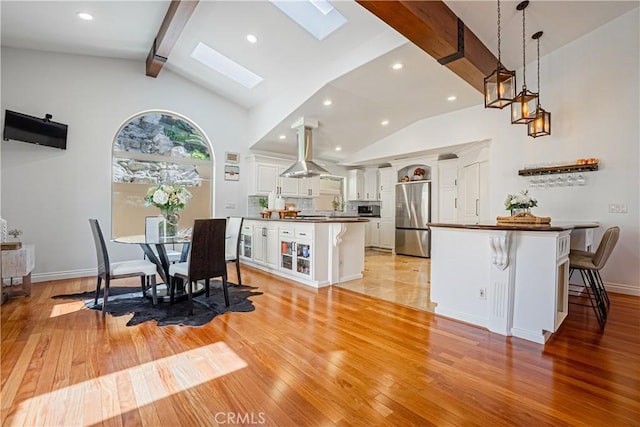 424 Camino De Encanto, Redondo Beach, CA 90277 - dining space featuring recessed lighting, baseboards, light wood-type flooring, beam ceiling, and a skylight