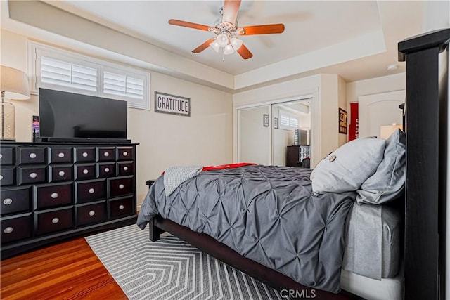 424 Camino De Encanto, Redondo Beach, CA 90277 - bedroom with ceiling fan, a raised ceiling, a closet, and wood finished floors
