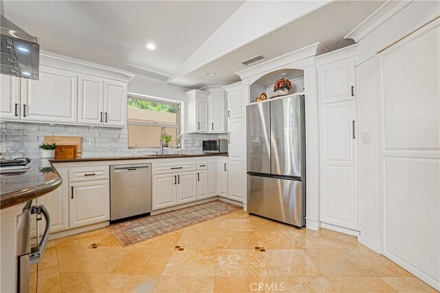 424 Camino De Encanto, Redondo Beach, CA 90277 - kitchen with dark countertops, white cabinets, visible vents, backsplash, and appliances with stainless steel finishes