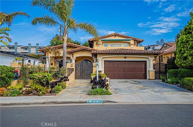 424 Camino De Encanto, Redondo Beach, CA 90277 - mediterranean / spanish house with a tile roof, concrete driveway, an attached garage, and stucco siding