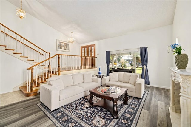 41018 40th St W, Palmdale, CA 93551 - living room with stairs, wood finished floors, a chandelier, and vaulted ceiling
