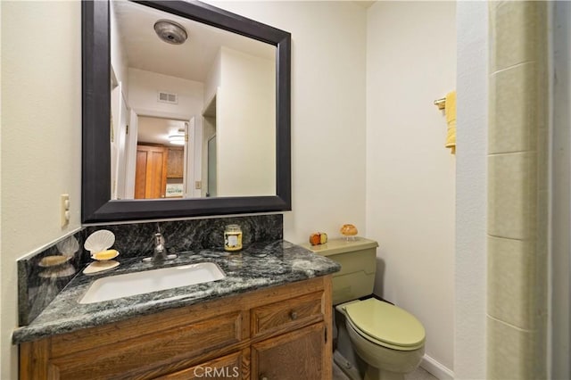 41018 40th St W, Palmdale, CA 93551 - half bathroom with vanity, toilet, and baseboards