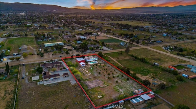 41018 40th St W, Palmdale, CA 93551 - aerial view at dusk of property boundaries highlighted and a mountain view
