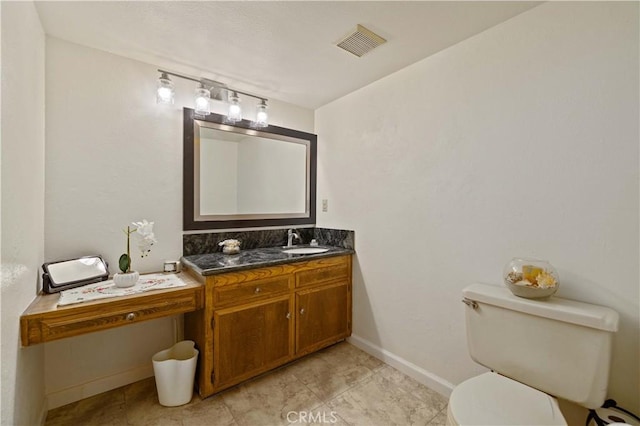 41018 40th St W, Palmdale, CA 93551 - bathroom featuring toilet, vanity, and baseboards